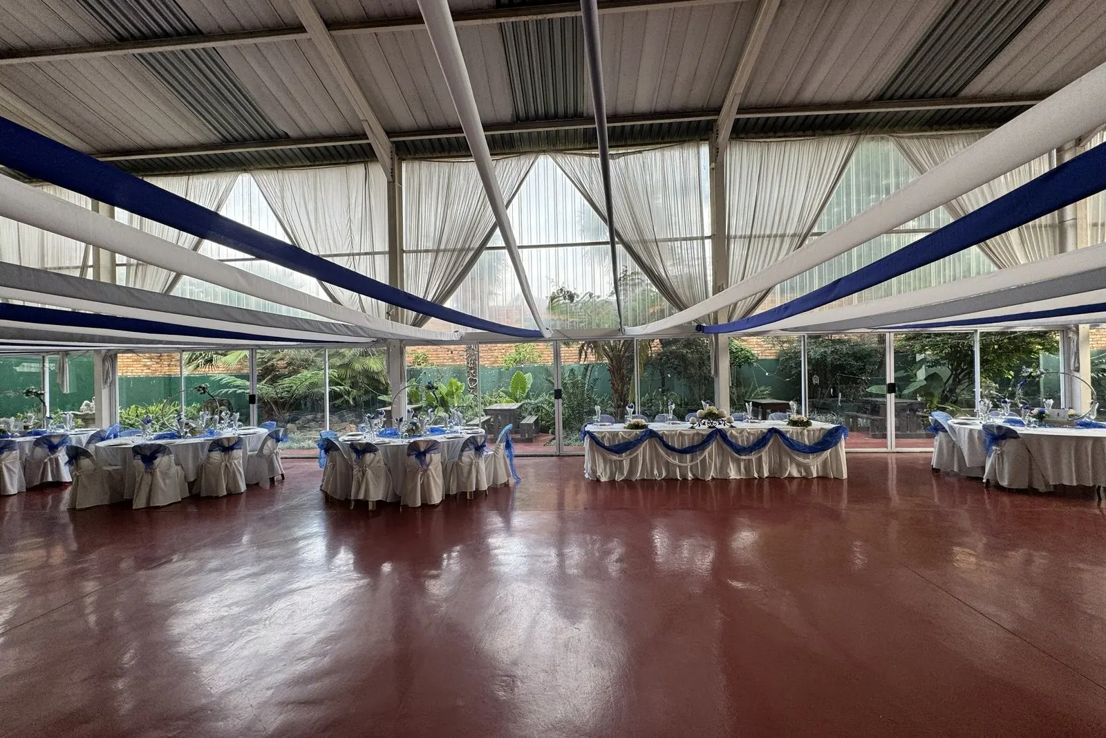 Hilgard Hall set up for a function with a polished dance floor